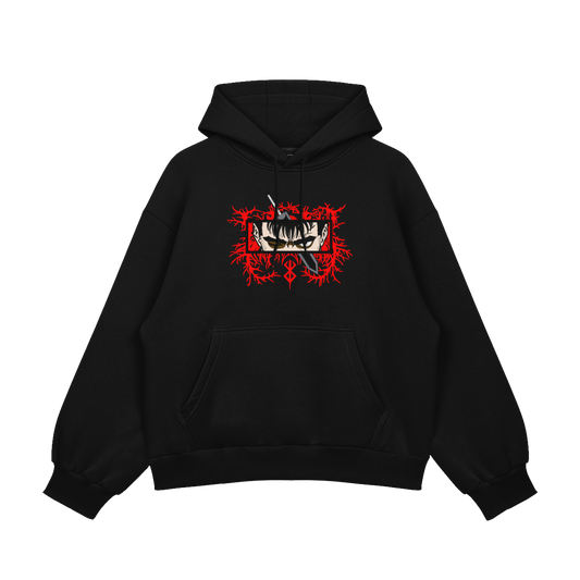 Guts Embroidered Oversized Hoodie featuring bold red embroidery on a black fleece background.