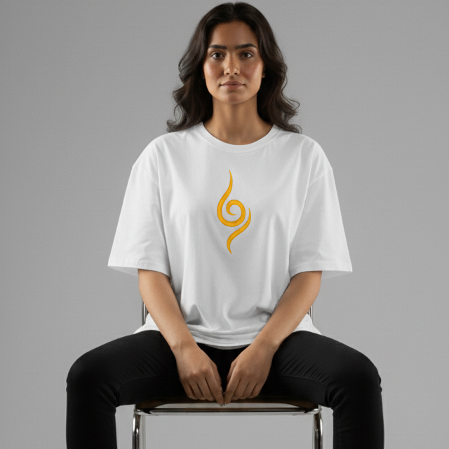 Model wearing Kurama embroidered oversized t-shirt featuring a bold orange chakra design on white fabric.
