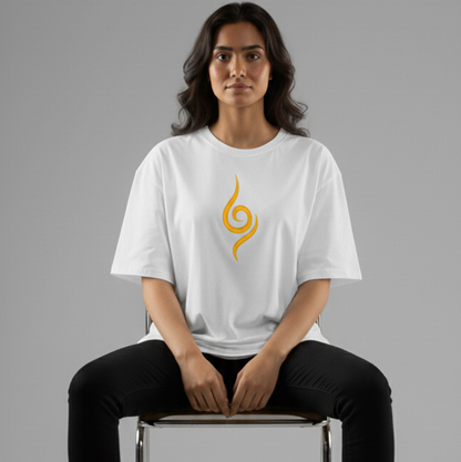Model wearing Kurama embroidered oversized t-shirt featuring a bold orange chakra design on white fabric.